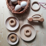 Holzscheibe und Stäbchen